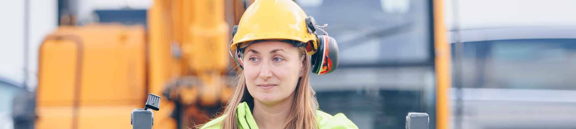female labour hire worker on excavator